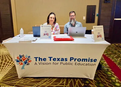 We used our tablecover to set up a table to distribute copies of our visioning document for Texas public schools