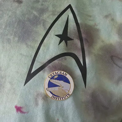 Hard Enamel Pin - The first Cetacean Institute lapel pin proudly worn on our presidents Star Trek t-shirt