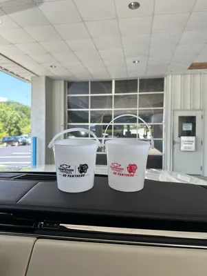 Colored Drink Buckets - Giving away free popcorn for our high school football game