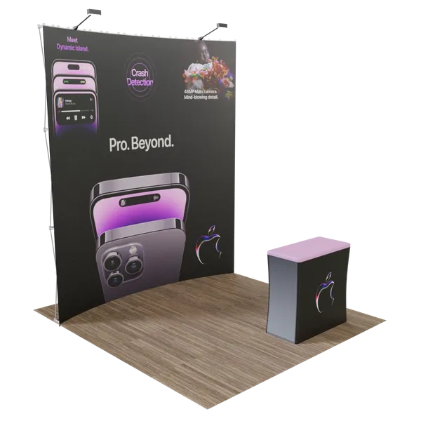 A promotional display features a large smartphone, with text highlighting features such as 'Meet Dynamic Island, Crash Detection' and 'Pro. Beyond.' A matching counter stands nearby.